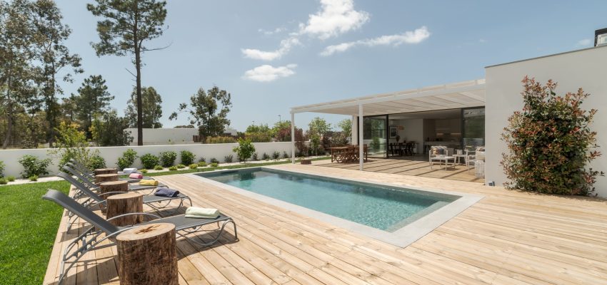 Modern house with garden swimming pool and wooden deck Modern house with garden swimming pool and wooden deck